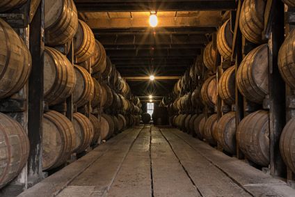 Barrels of American whiskey maturing in warehouse