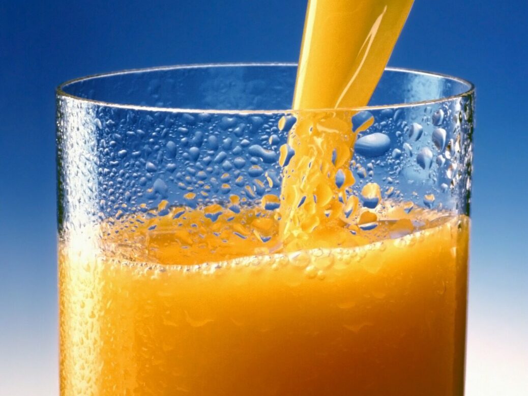 Orange juice being poured