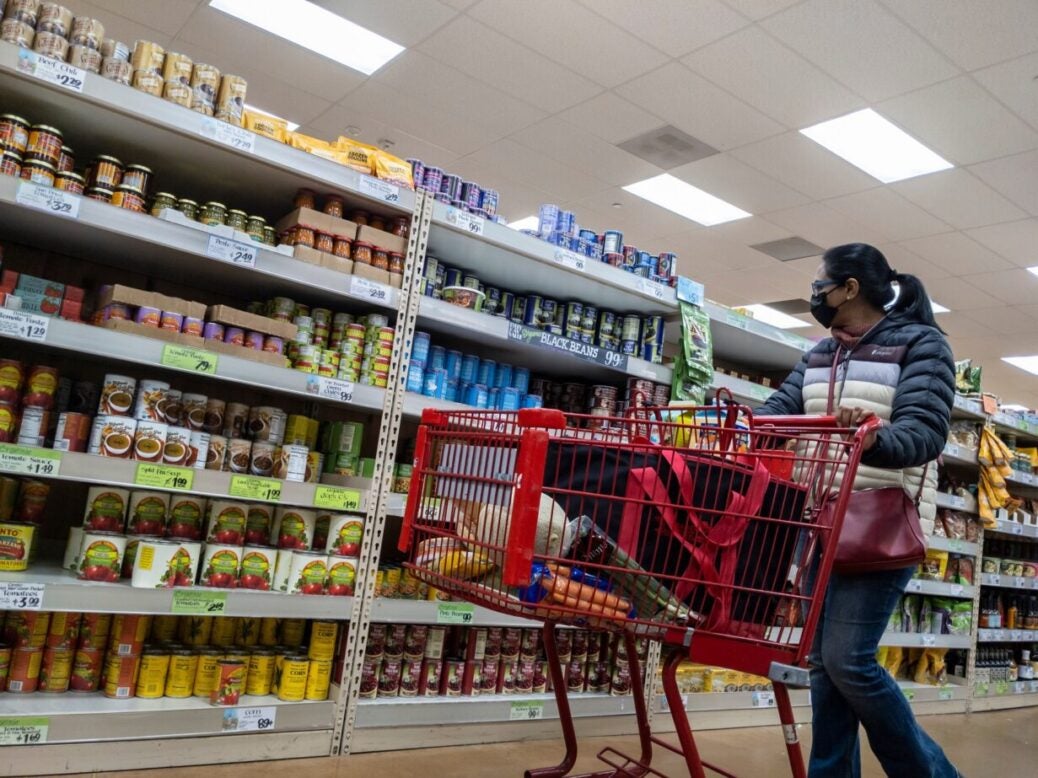 Woman shopping at a Trader Joe's retail store, Kirkland, Washington State, February 2022