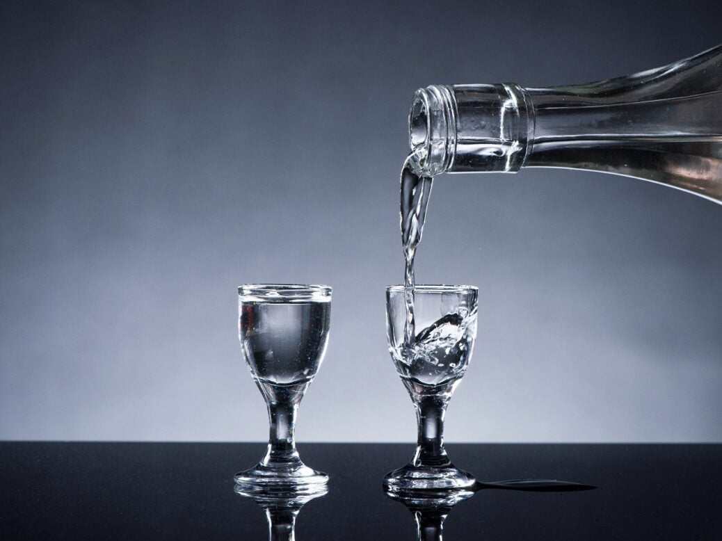 Clear liquor poured into glass