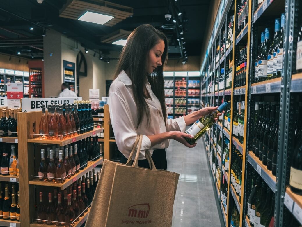 Woman in a liquor store shopping for wine, Town Square, Dubai, United Arab Emirates on 10 August 2022