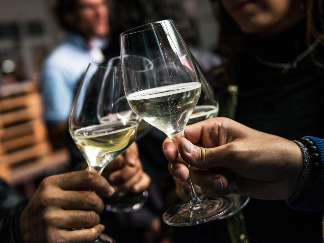 Group raise toast with sparkling wine, an area of focus for partnership between Mondavi and Valdo