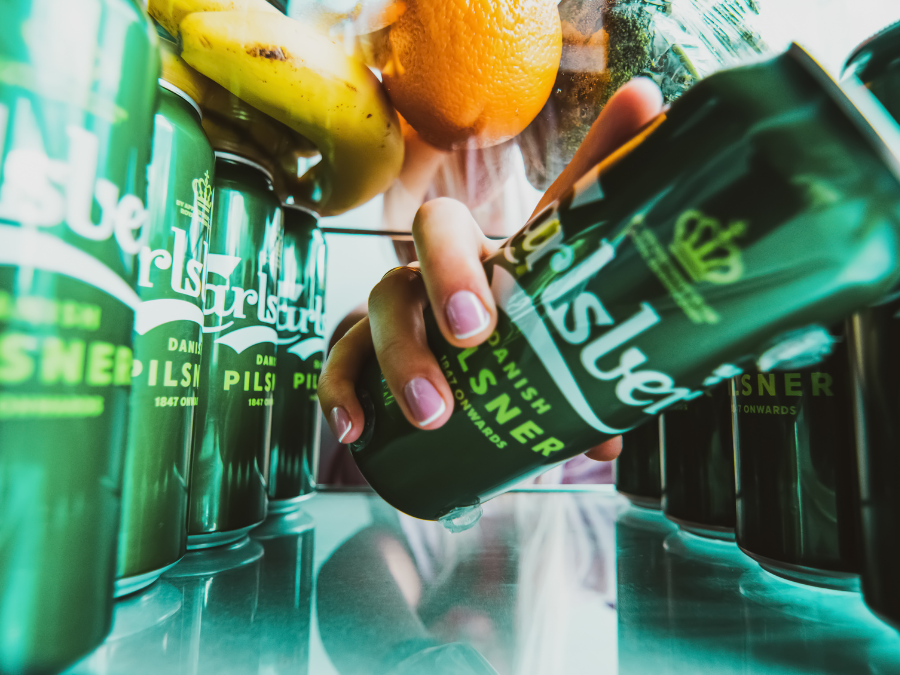 Carlsberg cans in a fridge.