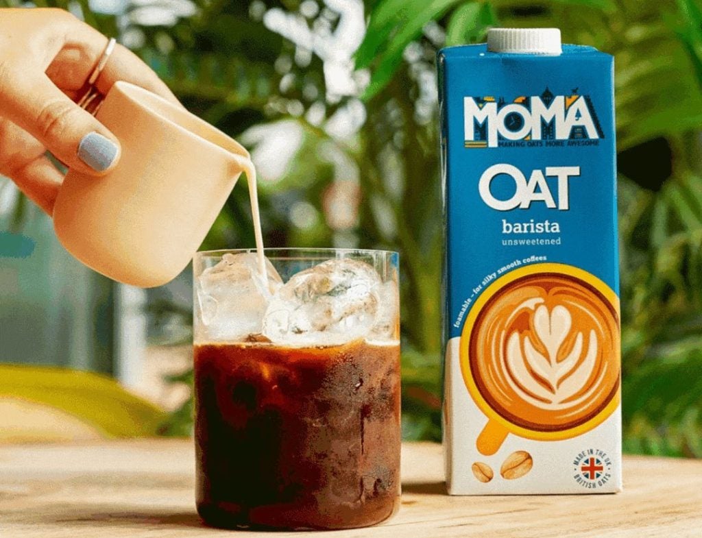 Moma oat drink poured into glass