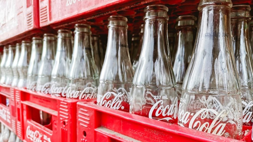 Empty glass Coca-Cola bottles