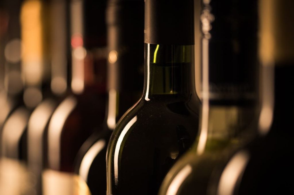 Blurred image of glass wine bottles
