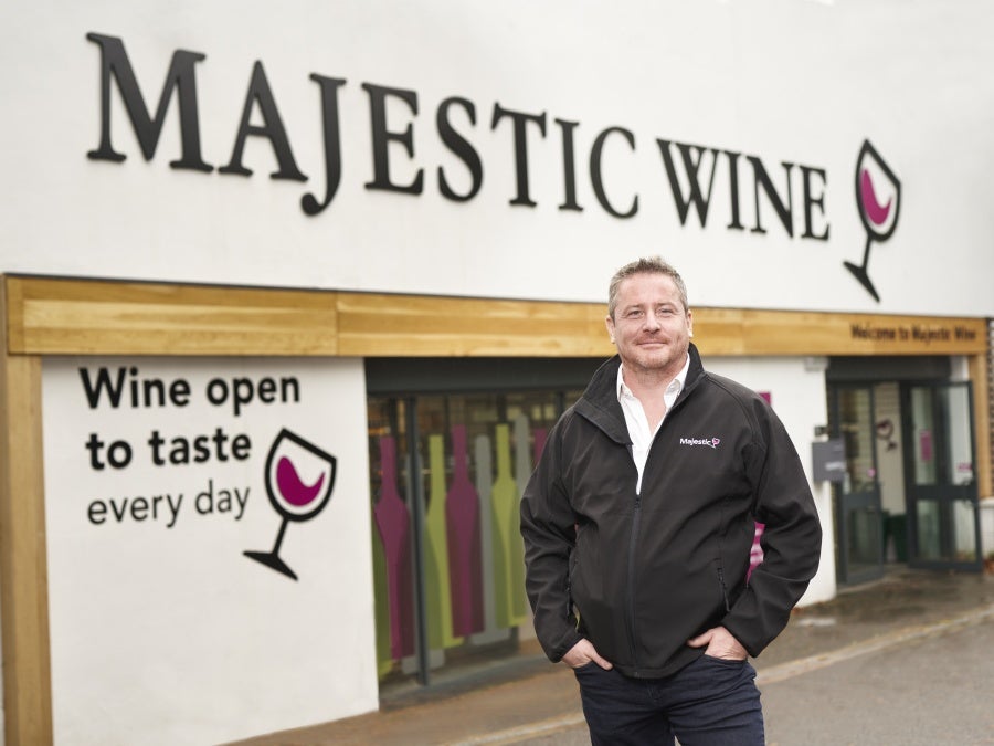 John Colley, CEO of Majestic Wine shop stands outside a shop in the UK