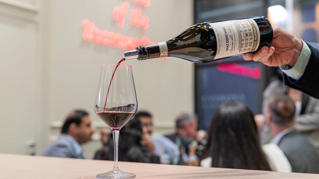 A bottle of Pasqua Wines’ Mai Dire Mai Amarone Della Valpolicella being poured