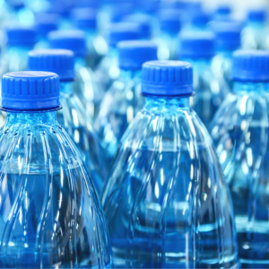 A lot of blue plastic bottles next to each other
