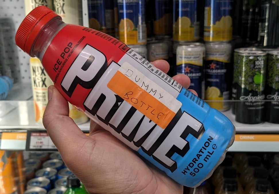 A bottle of Prime Hydration with a label saying 'Dummy Bottle'