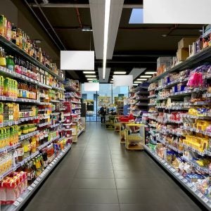 Supermarket juice and sweets aisle.