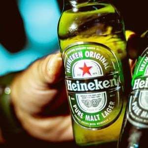 Heineken, Beer. Photograph of two men toasting with two bottles of heineken beer. Brasília, Federal District - Brazil. Circa, September, 2019.
