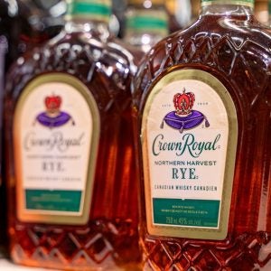 Close up of Crown Royal Canadian whisky bottle on store shelf. Toronto, Canada - November 20, 2025.