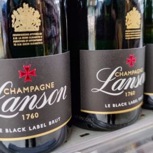 Close-up on bottles of Lanson brand champagnes from the shelf of a supermarket in France