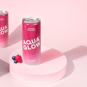 Two pink cans, "Aqua Glow" brand on pale pink background with berries.