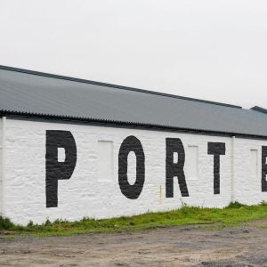 Port Ellen, Islay, Scotland - May 14 2022: An old warehouse of the Port Ellen distillery on the isle of Islay. It was closed in 1983 and reopened in 2024.